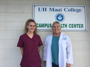 Dr. Denise Cohen and King Kekaulike intern Hayley pose in front of the UH Maui Campus Health Center.