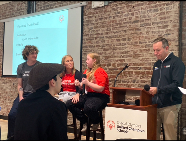 A couple of ladies speak at the Special Olympics conference.