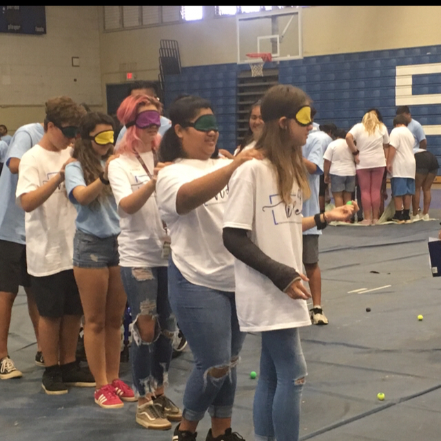 Group of students participating in the challenges at the leadership convention.