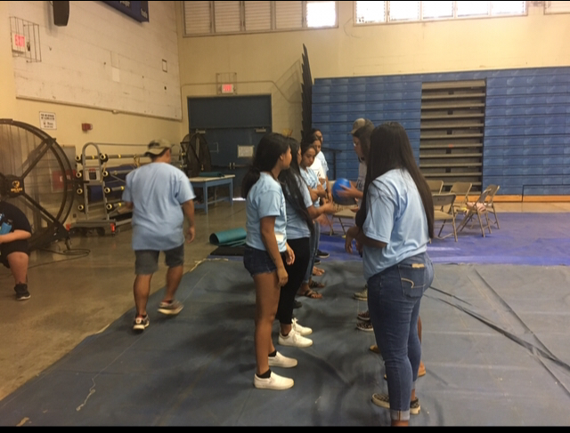 Group of students participating in a challenge at the leadership convention.