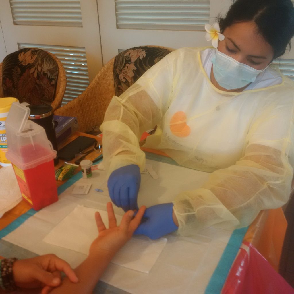 Jade Dela Cruz checking blood.