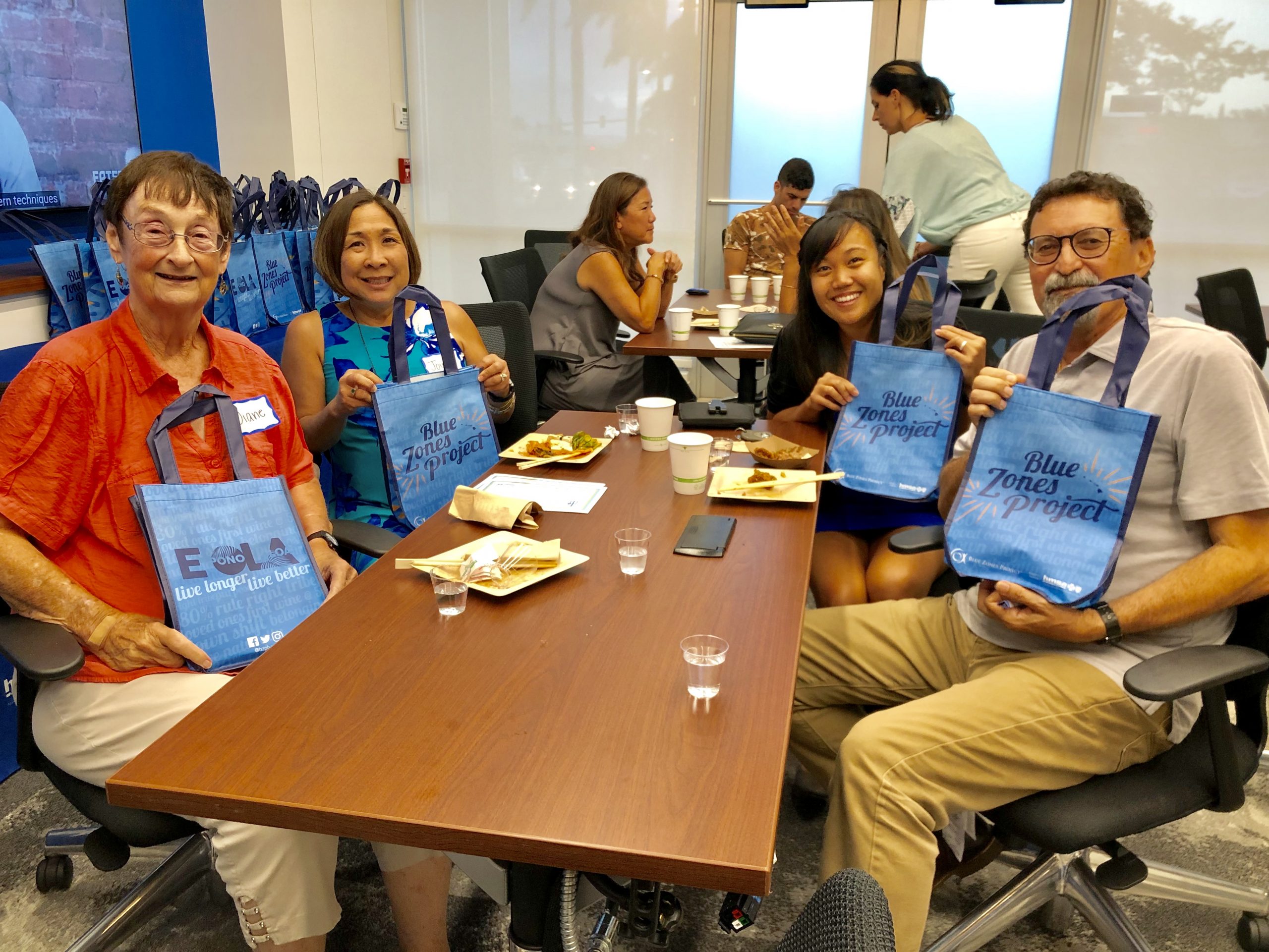 Maui College's faculty show their support of Blue Zones by showing off their Blue Zones tote bags