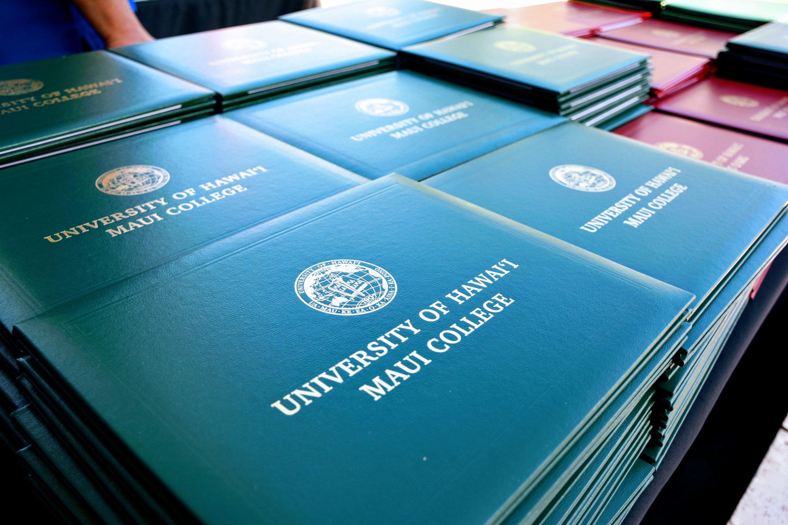 A stack of UHMC diplomas